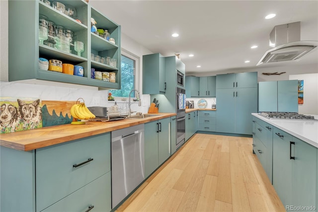 3163 S Boston Ct, Denver, CO 80231 - kitchen featuring a sink, appliances with stainless steel finishes, light wood-style flooring, wood counters, and recessed lighting