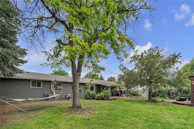 3163 S Boston Ct, Denver, CO 80231 - back of property with a chimney and a patio area