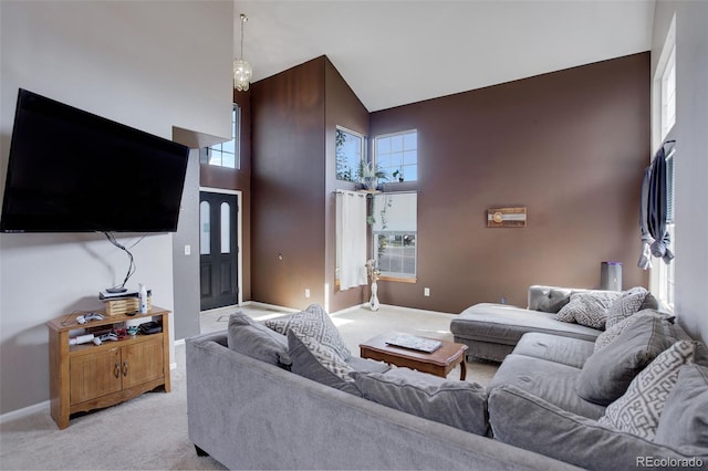 living room featuring light carpet and high vaulted ceiling