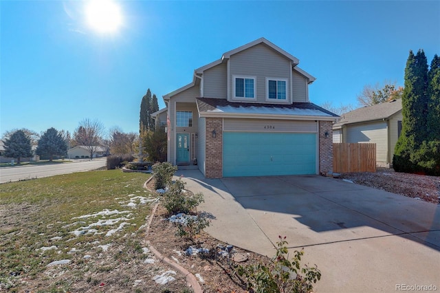 front of property with a garage and a front lawn