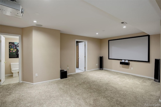 home theater with light colored carpet