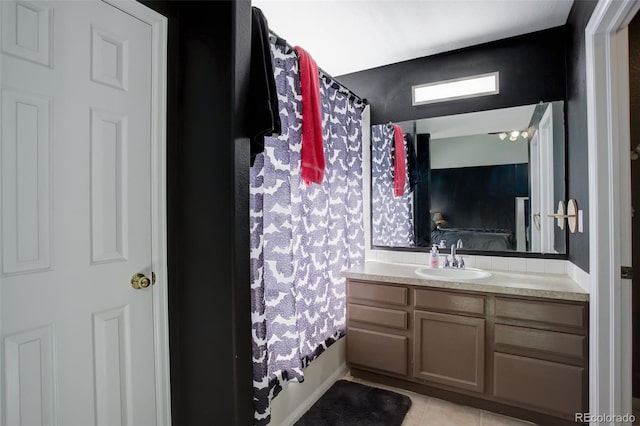 bathroom featuring tile patterned flooring, vanity, and shower / bath combo