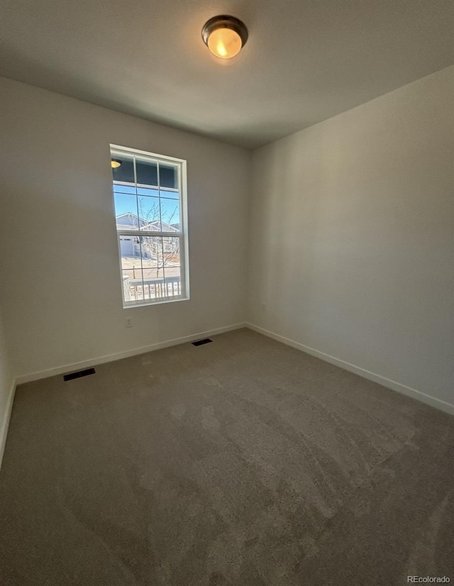 empty room featuring carpet floors