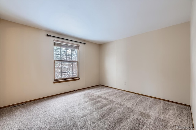 spare room featuring carpet flooring