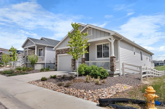 2060 Peralta Loop, Castle Rock, CO 80104 - craftsman inspired home featuring a porch, board and batten siding, concrete driveway, and stone siding