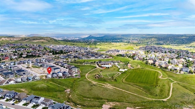 2060 Peralta Loop, Castle Rock, CO 80104 - aerial view of property's location featuring nearby suburban area and a mountain backdrop