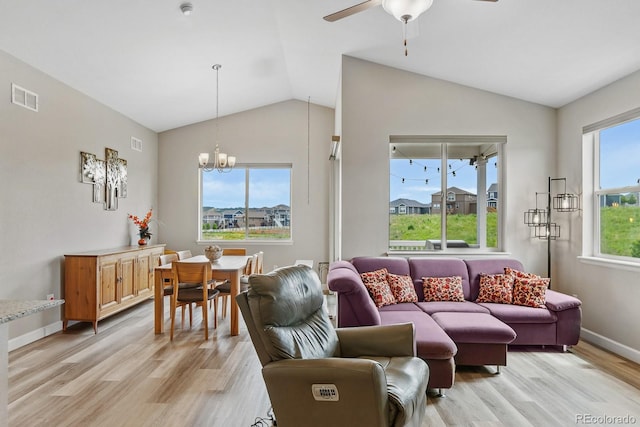 2060 Peralta Loop, Castle Rock, CO 80104 - living room with vaulted ceiling, light wood-style flooring, ceiling fan, a chandelier, and baseboards