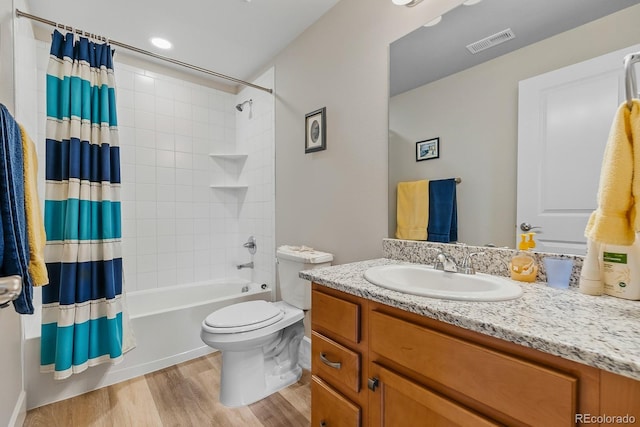 2060 Peralta Loop, Castle Rock, CO 80104 - bathroom with vanity, wood finished floors, shower / bath combo with shower curtain, and toilet