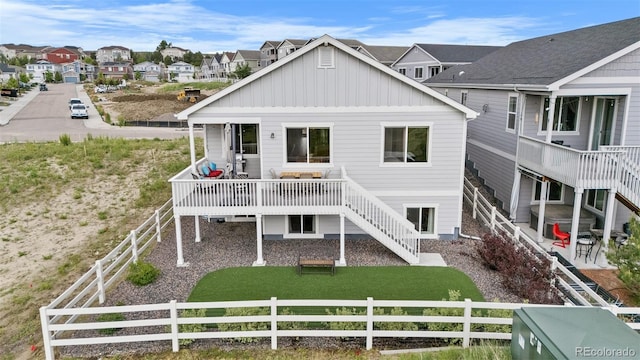 2060 Peralta Loop, Castle Rock, CO 80104 - back of house with board and batten siding, a fenced backyard, a residential view, and a wooden deck
