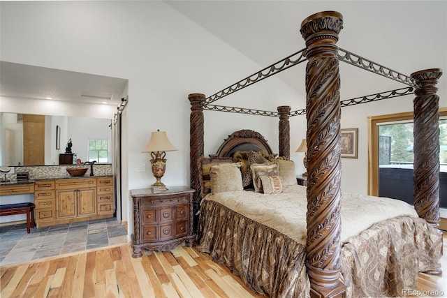 178 Cree Ct, Lyons, CO 80540 - bedroom featuring light wood finished floors and high vaulted ceiling