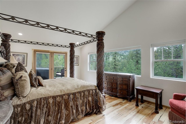 178 Cree Ct, Lyons, CO 80540 - bedroom with access to outside, high vaulted ceiling, light wood finished floors, multiple windows, and recessed lighting
