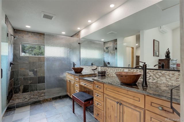 178 Cree Ct, Lyons, CO 80540 - full bath featuring a walk in shower, double vanity, tasteful backsplash, recessed lighting, and a wall unit AC