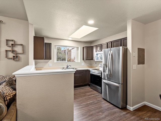 kitchen featuring dark wood-type flooring, stainless steel appliances, and dark brown cabinetry