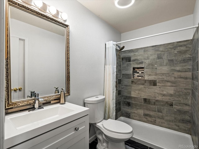 bathroom featuring vanity, a shower with curtain, and toilet