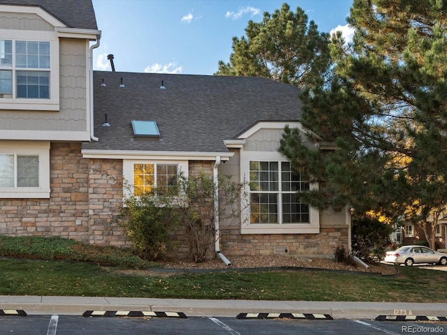 view of property exterior featuring a lawn