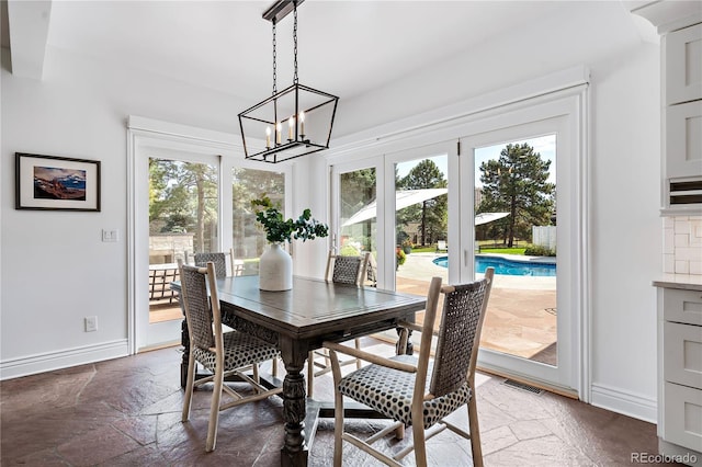 dining room with a notable chandelier