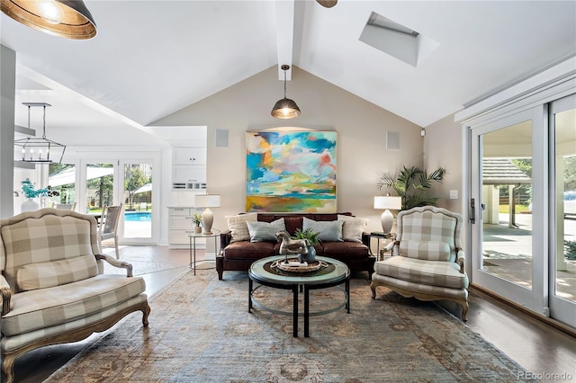 living area with an inviting chandelier, wood-type flooring, and lofted ceiling with beams