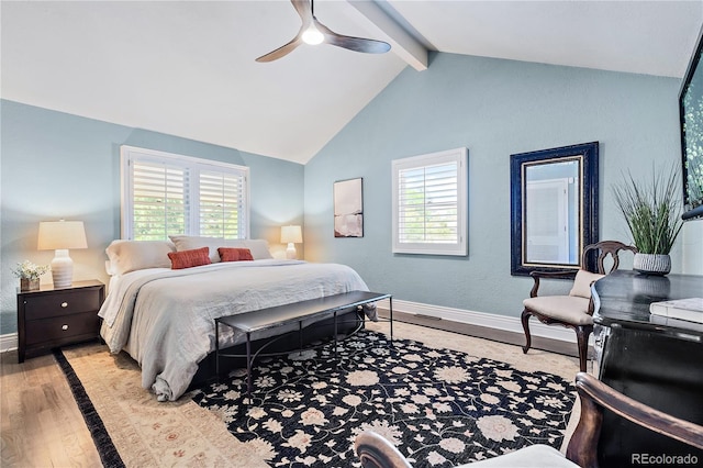 bedroom featuring vaulted ceiling with beams, ceiling fan, and light wood-type flooring