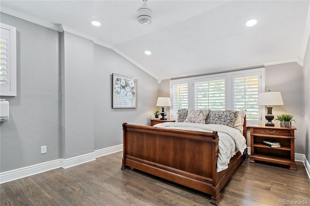 bedroom featuring dark wood-type flooring, crown molding, and vaulted ceiling