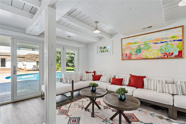 living room with beamed ceiling, wood-type flooring, wood ceiling, and french doors