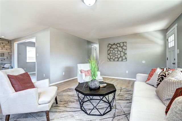 2921 E Colorado Ave, Denver, CO 80210 - living area featuring light wood-type flooring, a fireplace, and baseboards