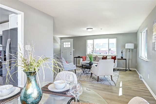 2921 E Colorado Ave, Denver, CO 80210 - dining space featuring light wood-type flooring and baseboards