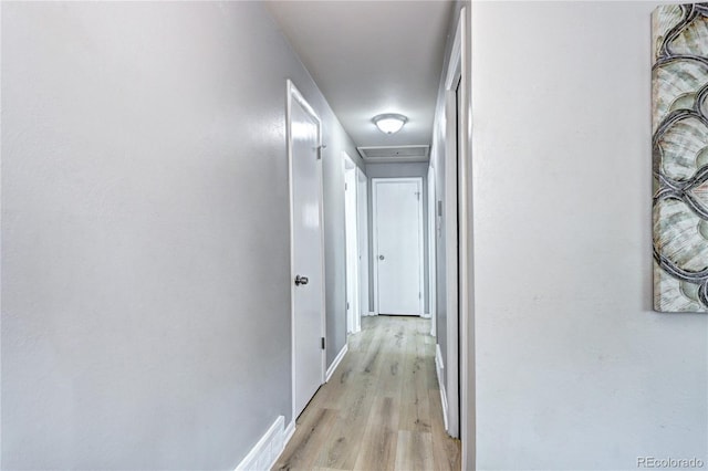 2921 E Colorado Ave, Denver, CO 80210 - hallway with light wood-type flooring, attic access, and baseboards
