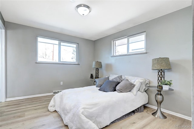 2921 E Colorado Ave, Denver, CO 80210 - bedroom with wood finished floors, visible vents, and baseboards