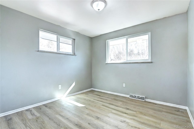 2921 E Colorado Ave, Denver, CO 80210 - unfurnished room featuring visible vents, baseboards, and wood finished floors