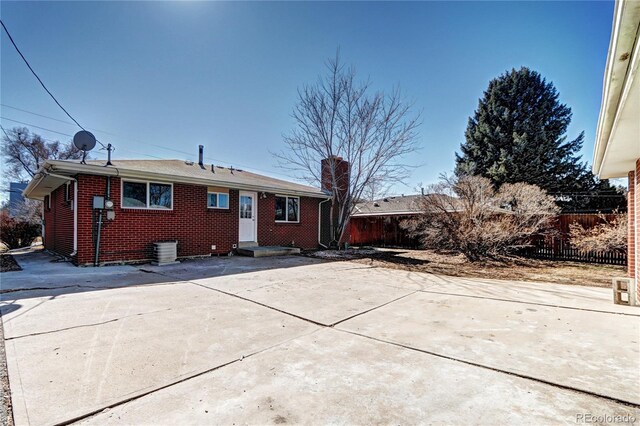 2921 E Colorado Ave, Denver, CO 80210 - rear view of property with brick siding and fence