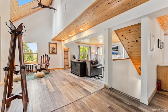 2028 Redhill Rd, Fairplay, CO 80440 - living room featuring wood finished floors, baseboards, wood ceiling, a ceiling fan, and a skylight