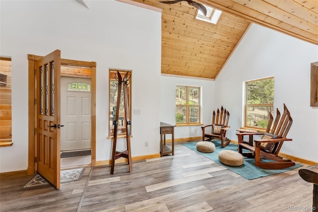2028 Redhill Rd, Fairplay, CO 80440 - living area with a skylight, baseboards, healthy amount of natural light, high vaulted ceiling, and wood ceiling