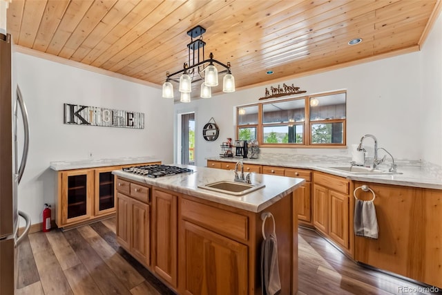 2028 Redhill Rd, Fairplay, CO 80440 - kitchen with wood ceiling, a sink, ornamental molding, a center island with sink, and appliances with stainless steel finishes