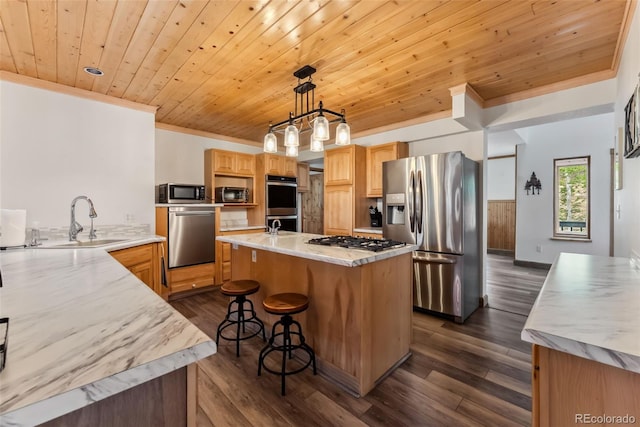 2028 Redhill Rd, Fairplay, CO 80440 - kitchen featuring appliances with stainless steel finishes, a sink, ornamental molding, wooden ceiling, and an island with sink