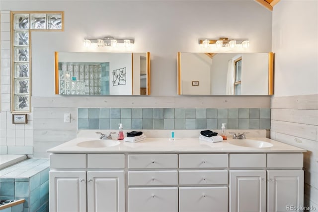 2028 Redhill Rd, Fairplay, CO 80440 - bathroom with double vanity, tasteful backsplash, and tile walls