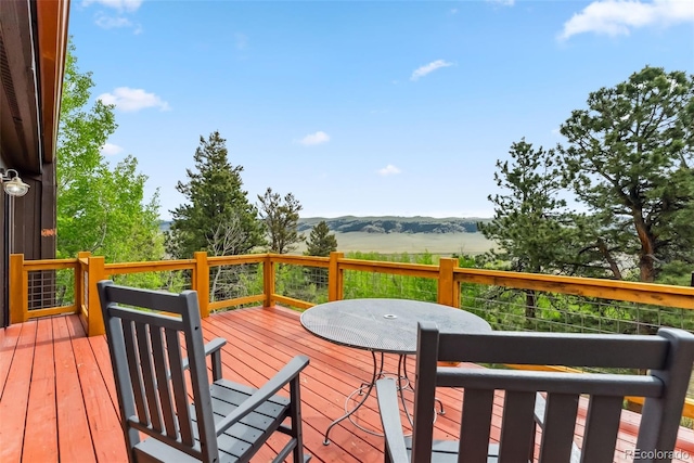 2028 Redhill Rd, Fairplay, CO 80440 - deck featuring a mountain view and outdoor dining space
