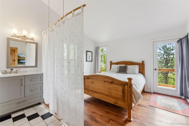 2028 Redhill Rd, Fairplay, CO 80440 - bedroom with a sink, light wood-style floors, high vaulted ceiling, and access to exterior