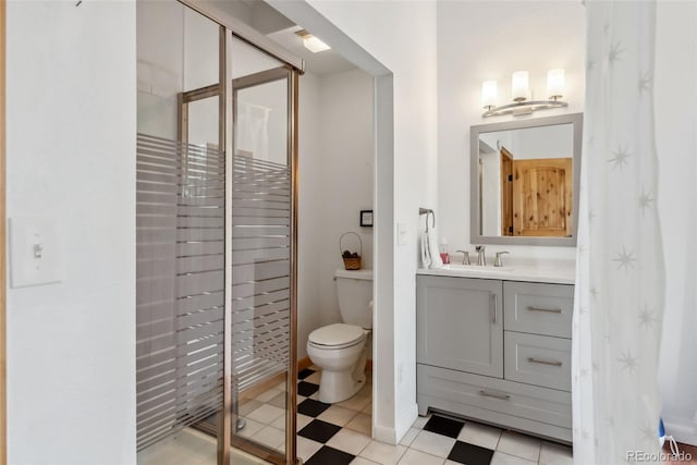 2028 Redhill Rd, Fairplay, CO 80440 - bathroom featuring a stall shower, toilet, vanity, and tile patterned floors