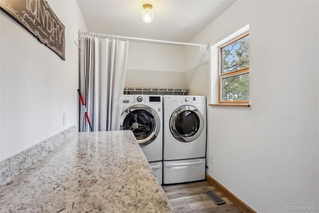 2028 Redhill Rd, Fairplay, CO 80440 - washroom featuring independent washer and dryer, light wood-type flooring, and baseboards