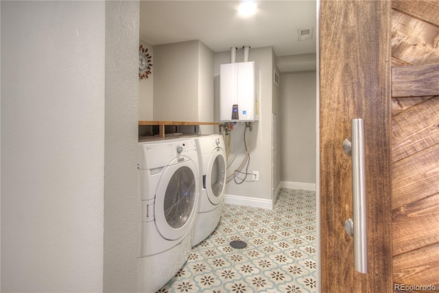 8140 S Storm King Peak, Littleton, CO 80127 - laundry room with independent washer and dryer and tankless water heater