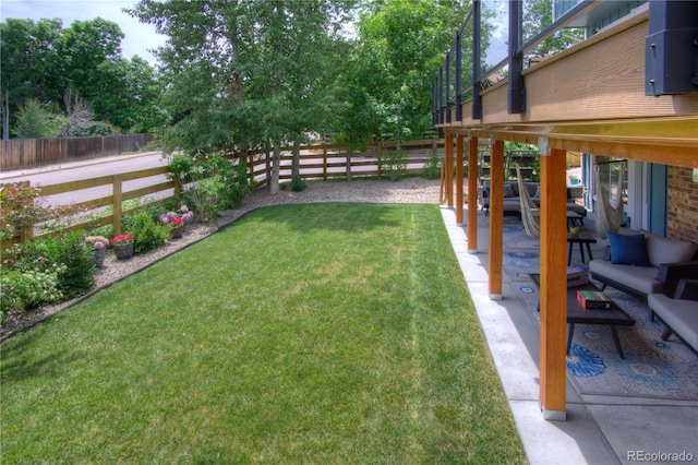 8140 S Storm King Peak, Littleton, CO 80127 - fenced backyard featuring a patio area and outdoor lounge area