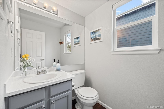 half bath with toilet and vanity