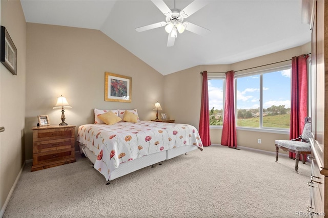 carpeted bedroom with lofted ceiling, baseboards, and a ceiling fan