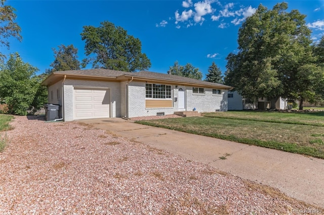 ranch-style house featuring concrete driveway, brick siding, an attached garage, and a front lawn