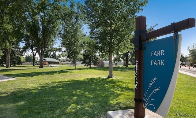 view of home's community with a lawn
