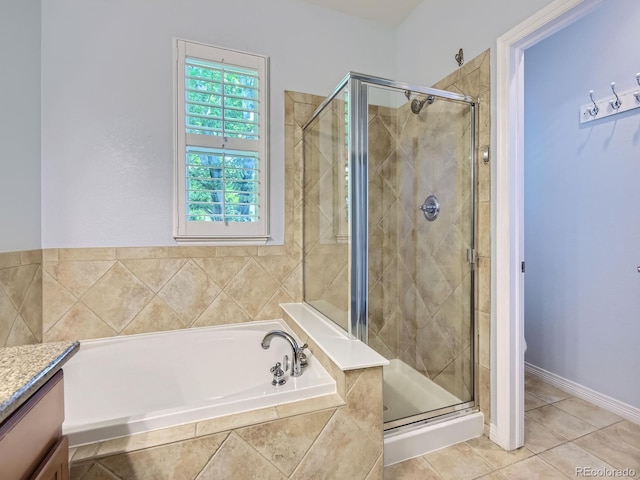 11883 E Fair Ave, Greenwood Village, CO 80111 - bathroom featuring a garden tub, a stall shower, vanity, and tile patterned floors