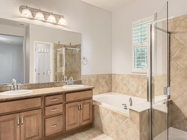 11883 E Fair Ave, Greenwood Village, CO 80111 - bathroom with a stall shower, a garden tub, double vanity, and tile patterned floors