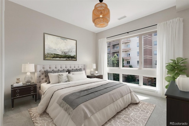 bedroom featuring light carpet