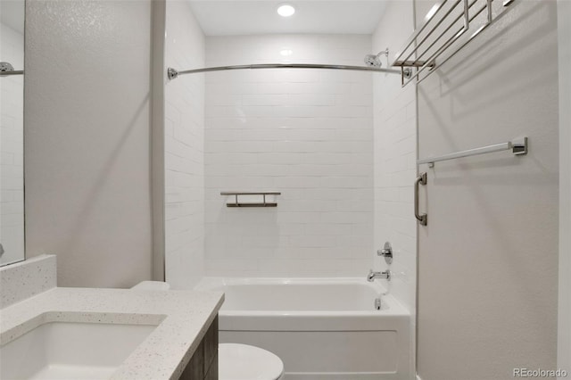 full bathroom featuring vanity, toilet, and tiled shower / bath