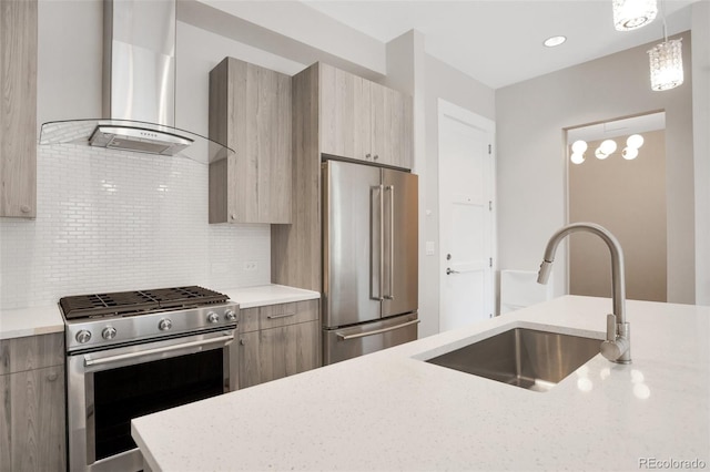 kitchen featuring pendant lighting, wall chimney exhaust hood, tasteful backsplash, light stone counters, and stainless steel appliances